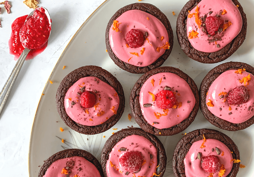 This image shows the chocolate beet cupcakes fully assembled with the frosting and toppings.