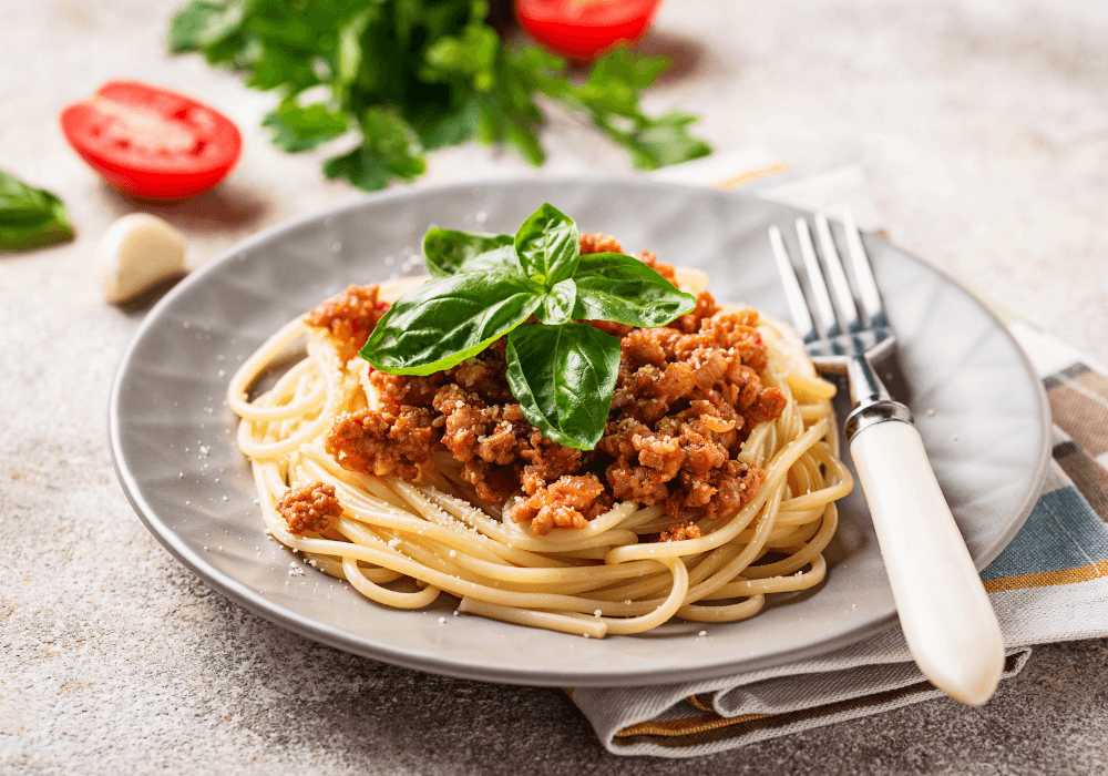 This image show as traditional omnivore dinner of spaghetti bolognese. This meal can be easily transformed to a plant-based meal.