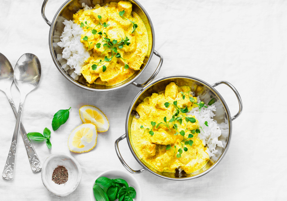 This image shows a meal of white rice with some curry on top. This is another easy meal to make more whole food plant-based.