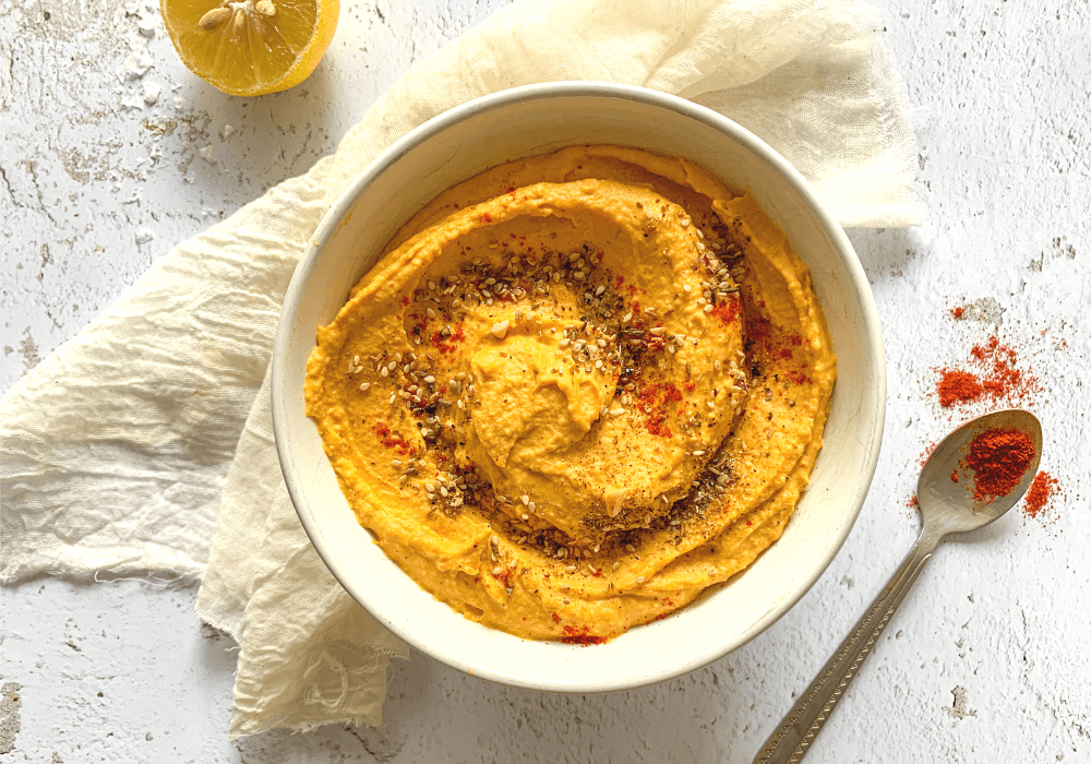 This image demonstrates one of the 3 components of the formula, a bean dip. Here it's a roasted carrot hummus.