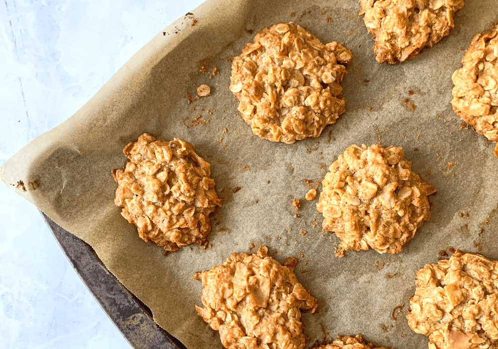 This image shows a close up of the peanut oat cookies on a baking sheet.