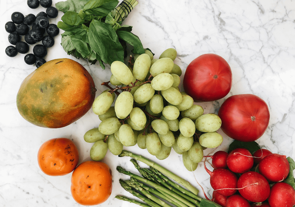 This image shows a variety of fruits and vegetables, representing an abundant plant-based diet.