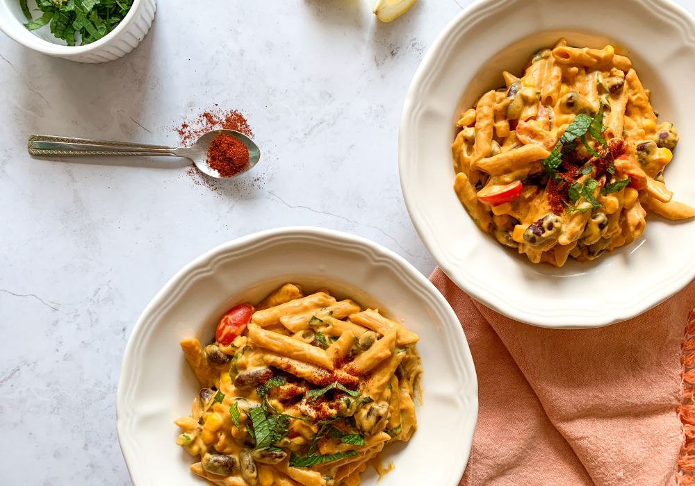 This image shows two bowls of my Healthy Loaded Mac and Cheese, which is a frequent dinner for me.