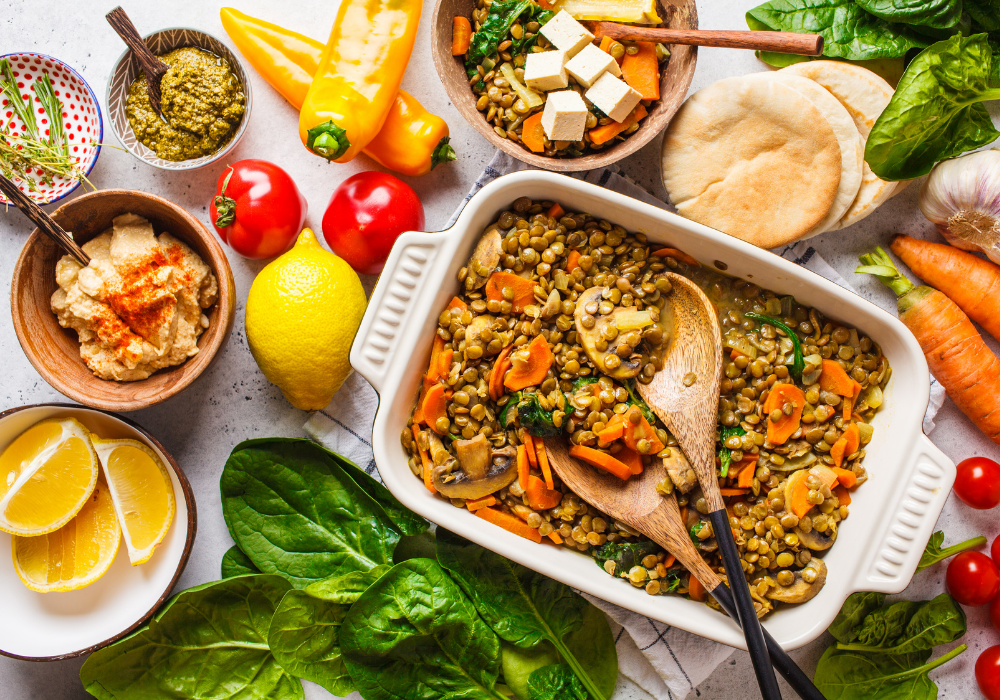 This image shows a delicious vibrant plant-based meal of a Mediterranean lentil and veggie casserole. 