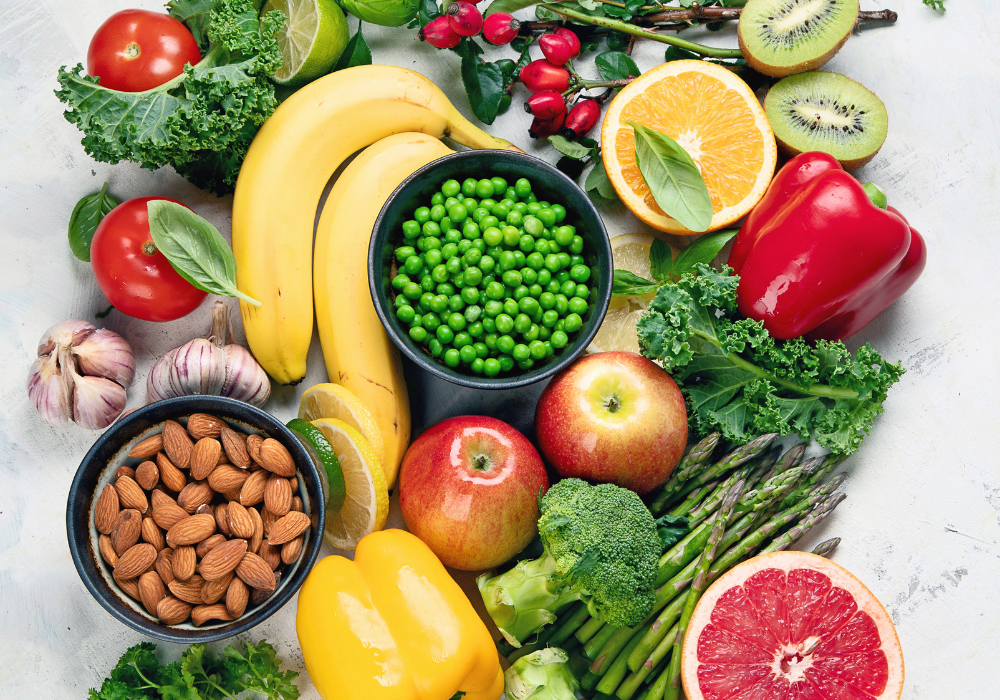 The sixth of the holistic habits for a plant-based diet is to optimize nutrient absorption. Image of a variety of fruits and veggies rich in vitamin c.